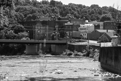 Downtown Hoosick Falls is seen from across the Hoosic River. The groundwater that supplies the village water system remains heavily contaminated, and a local manufacturing plant near the water supply was designated as a federal Superfund site last month. Joan K. Lentini photo