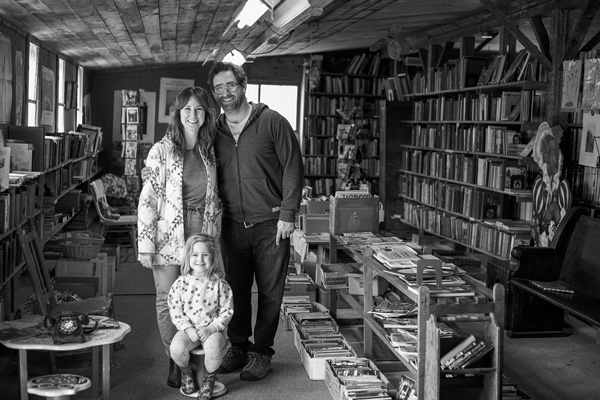 Sydney Nichols and Eric Kufs stand with their daughter Sally Jane in the children’s section at Owl Pen Books. Nichols and Kufs are the new owners of the 60-year-old vintage bookstore in Greenwich, N.Y. Joan K. Lentini photo