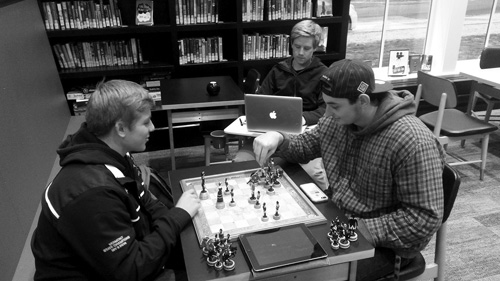 Students enjoy a game of chess at the new Manchester Community Library, which opened in November after years of planning.