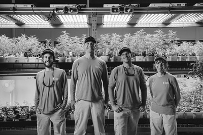 Mike Di Tomasso, Matt Lavallee, Chris Williams and Chris Motyka are among about 50 employees of Champlain Valley Dispensary and Southern Vermont Wellness, which operate Vermont’s largest legal marijuana-growing facility and supply medical marijuana dispensaries in Burlington and Brattleboro. Courtesy photo /Jessica Sipe