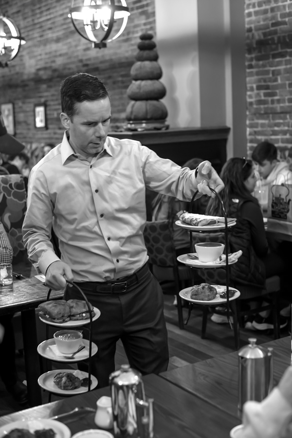 

Kevin Borowsky, co-owner and manager of The Whistling Kettle in Ballston Spa, delivers afternoon tea to customers. Joan K. Lentini photo