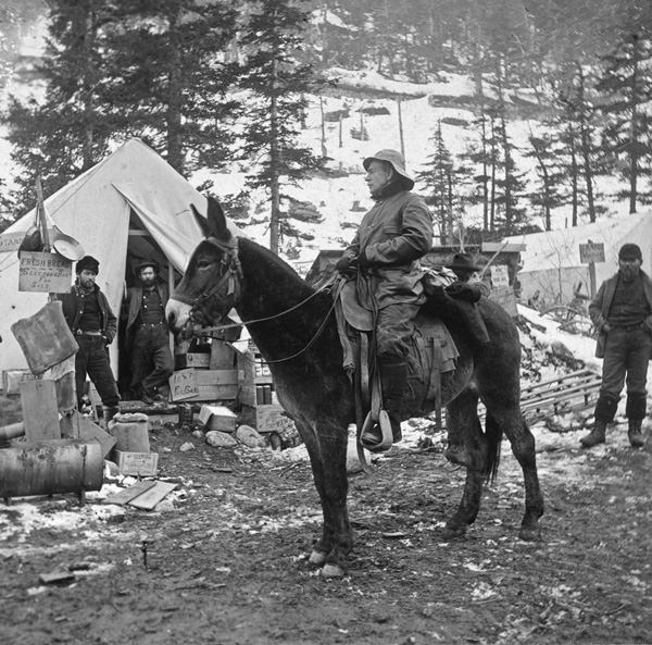 Postal Inspector John P. Clum, atop a mule, talks with miners in Nome, Alaska, in 1898. Clum, who grew up in Columbia County, N.Y., ran a newspaper in territorial Arizone before heading north. Photo courtesy of The Tombstone Epitaph