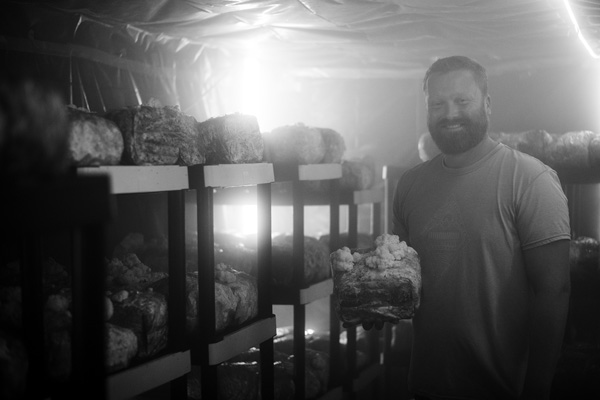 Jeff Killenberger of 518 Farms stands in an indoor growing room where he raises several varieties of mushrooms under controlled light and humidity. The farm in Hoosick Falls, N.Y., which also raises some varieties outdoors, grows mushrooms for gourmet cooking and medicinal preparations. Joan K. Lentini photo