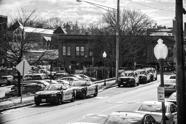 Police cruisers line the street outside Saratoga Springs City Hall. Photo by Joan K. Lentini