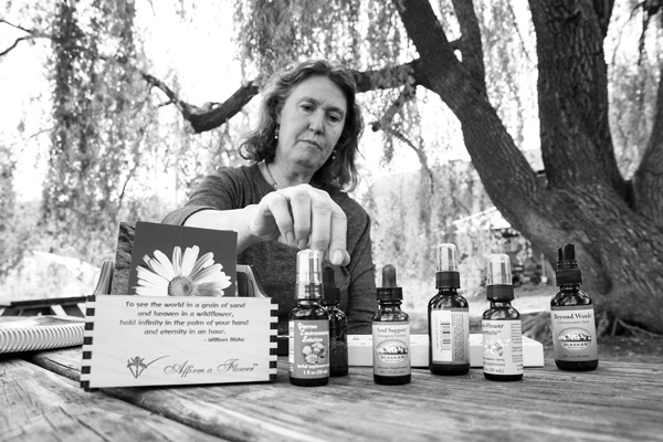 Moira Krum displays some of the dropper bottles of flower essences she uses in her therapy practice. Scott Langley photo Moira Krum displays some of the dropper bottles of flower essences she uses in her therapy practice. Scott Langley photo